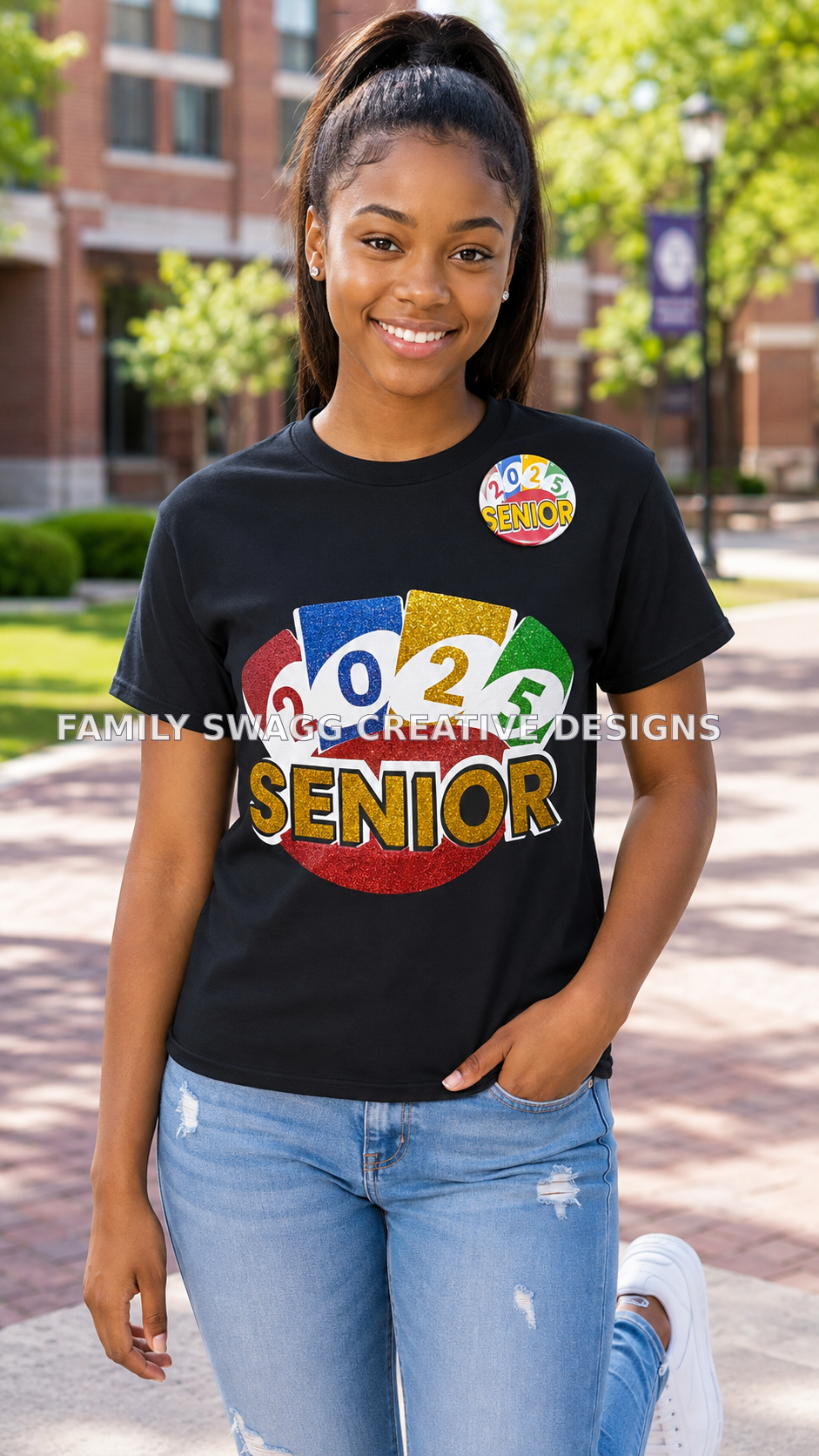 African-American teenage girl with a high ponytail modeling a black 2025 Senior shirt and matching button outside a school