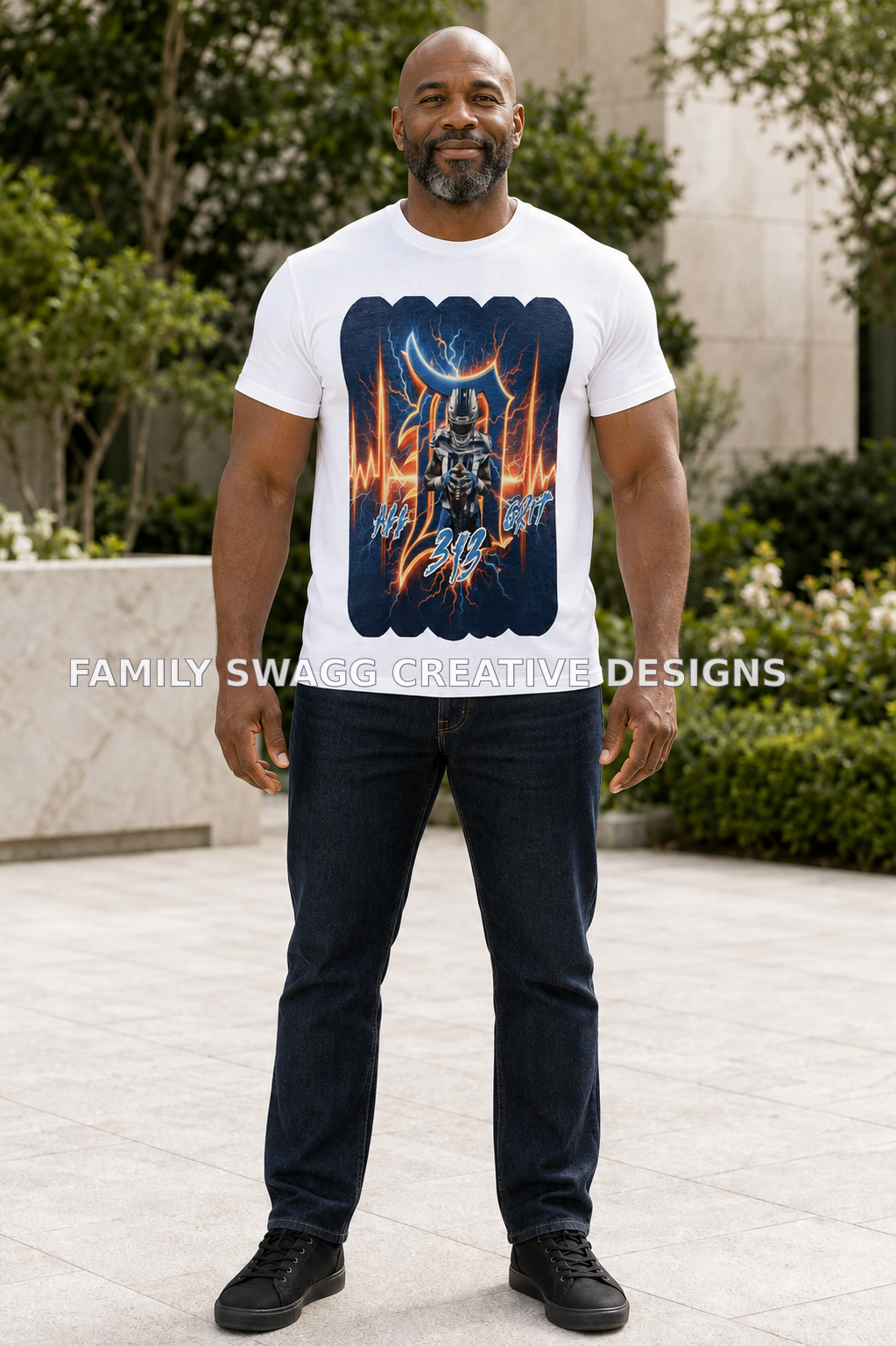 Mature African-American man modeling a white All Grit 313 football shirt outdoors