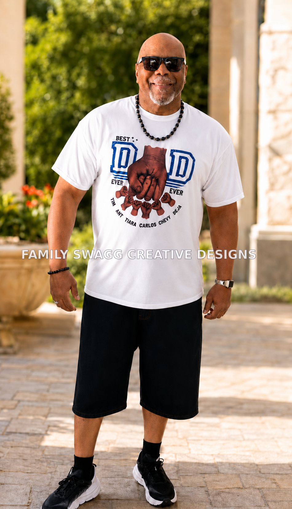 Model wearing a personalized white Best Dad Ever family fist-bump shirt outdoors