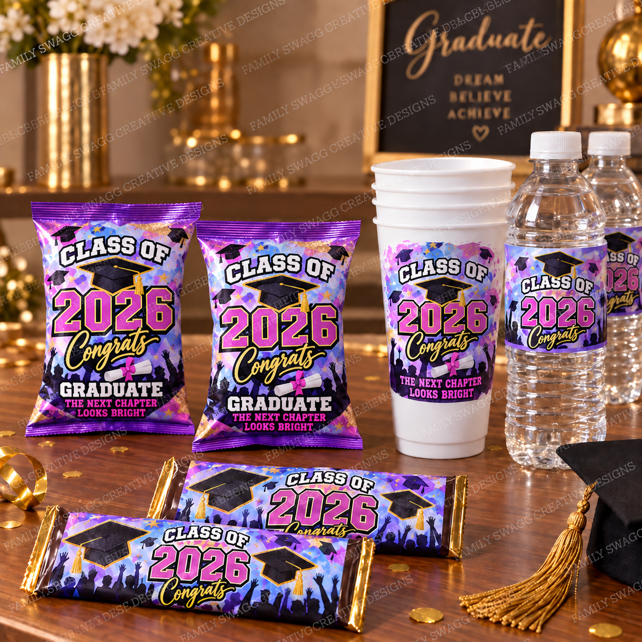Coordinated Class of 2026 party favors with snack-size chip bags, 16-ounce cups, full-size candy bars and 16.9-ounce water bottles on a warm wooden table