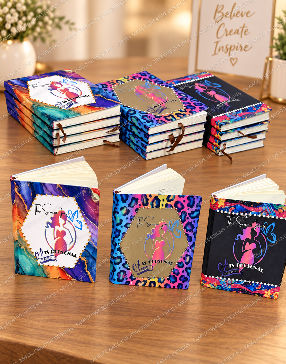 Colorful custom sublimated journals displayed on a warm wooden table