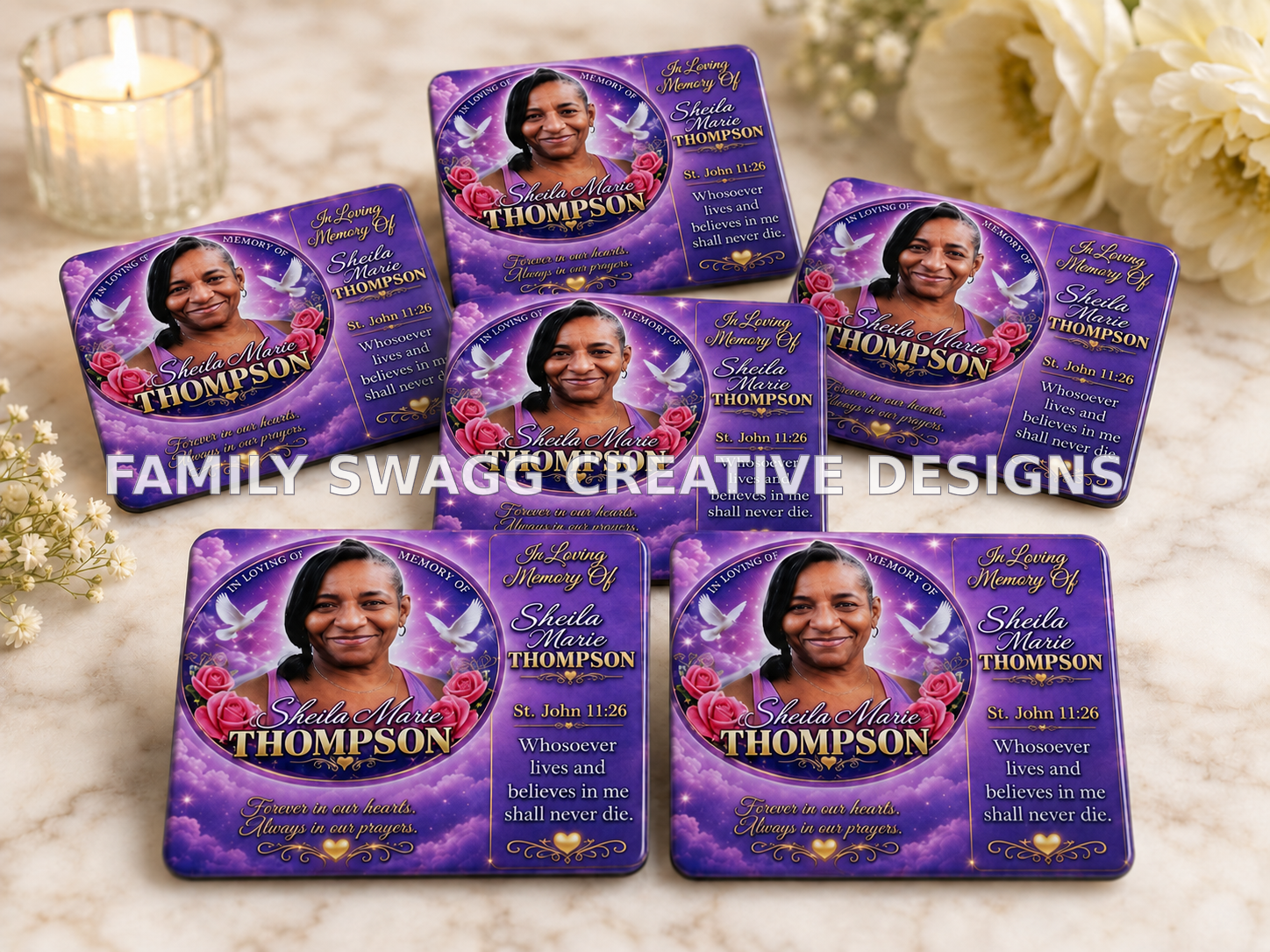 Close-up display of customized purple and gold Sheila Marie Thompson sublimation memorial magnets on an elegant ivory marble setting