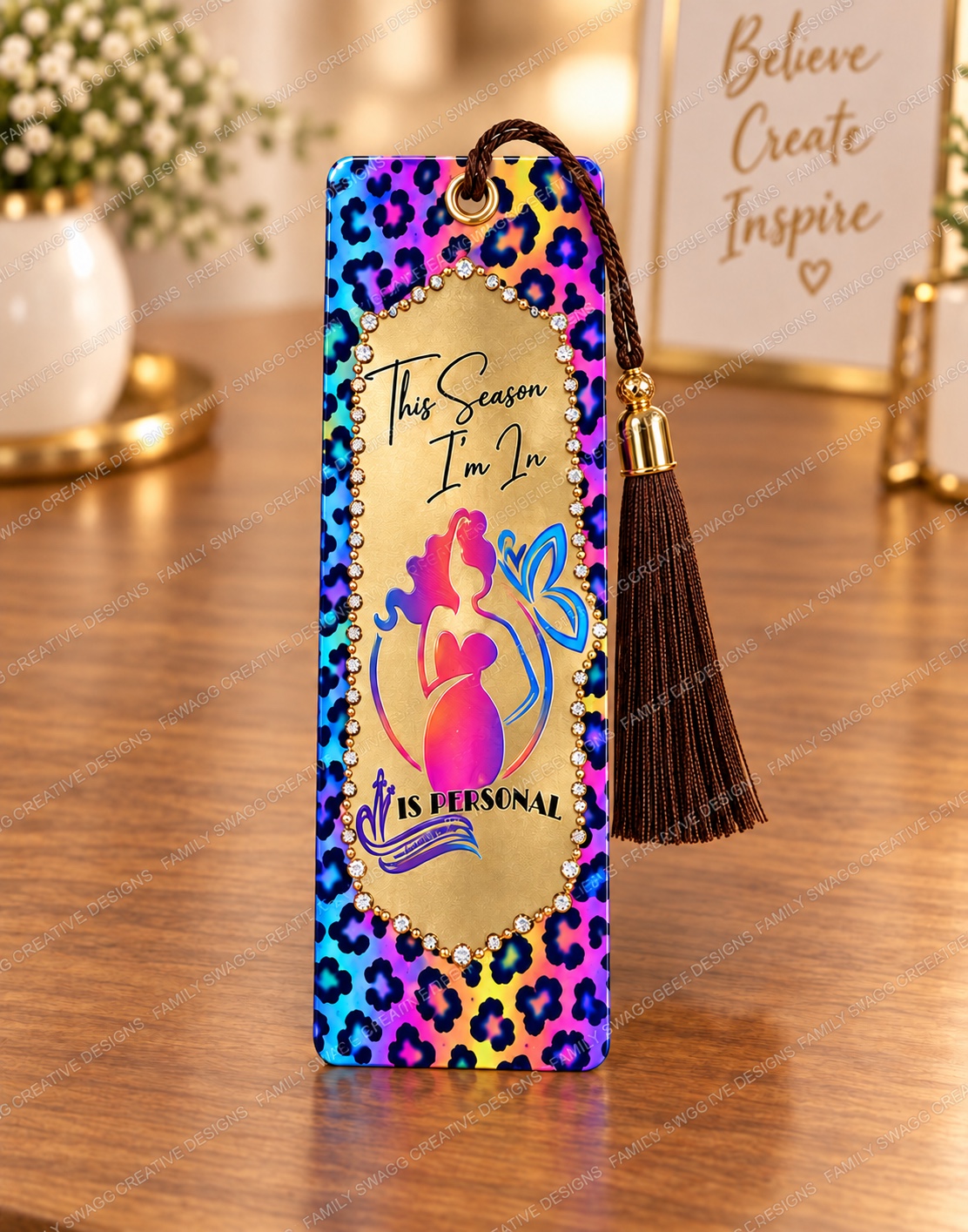 Colorful leopard-print sublimated bookmark with gold center, crystal accents and a brown tassel matching the custom journals