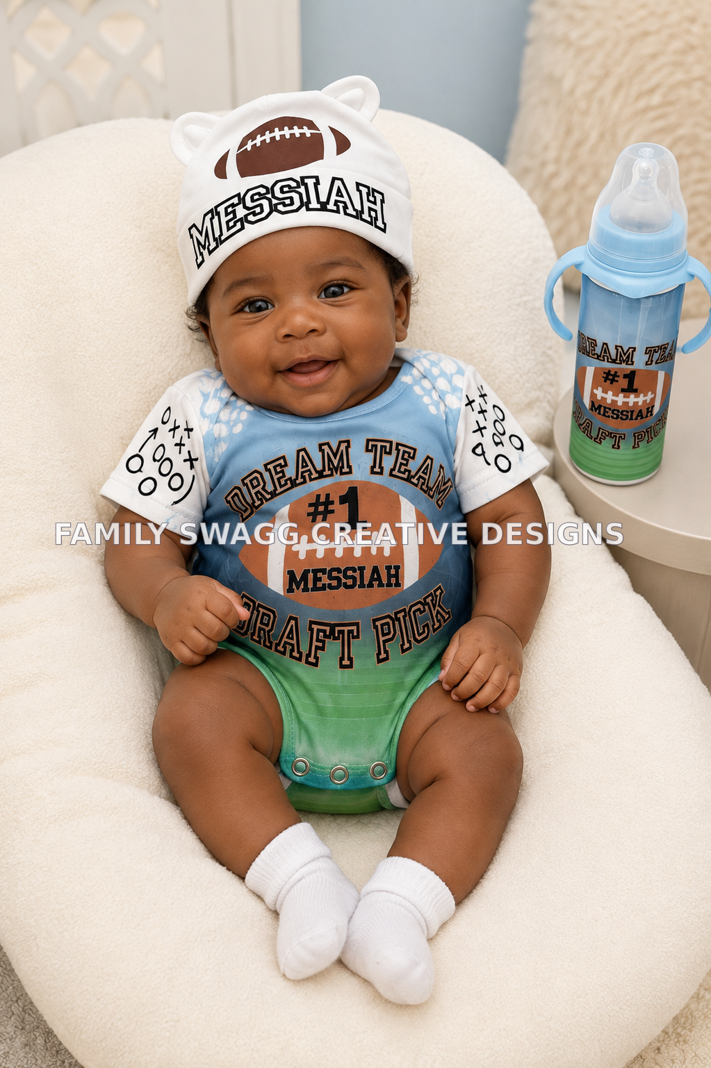 African-American infant wearing a personalized Messiah football outfit with matching bottle